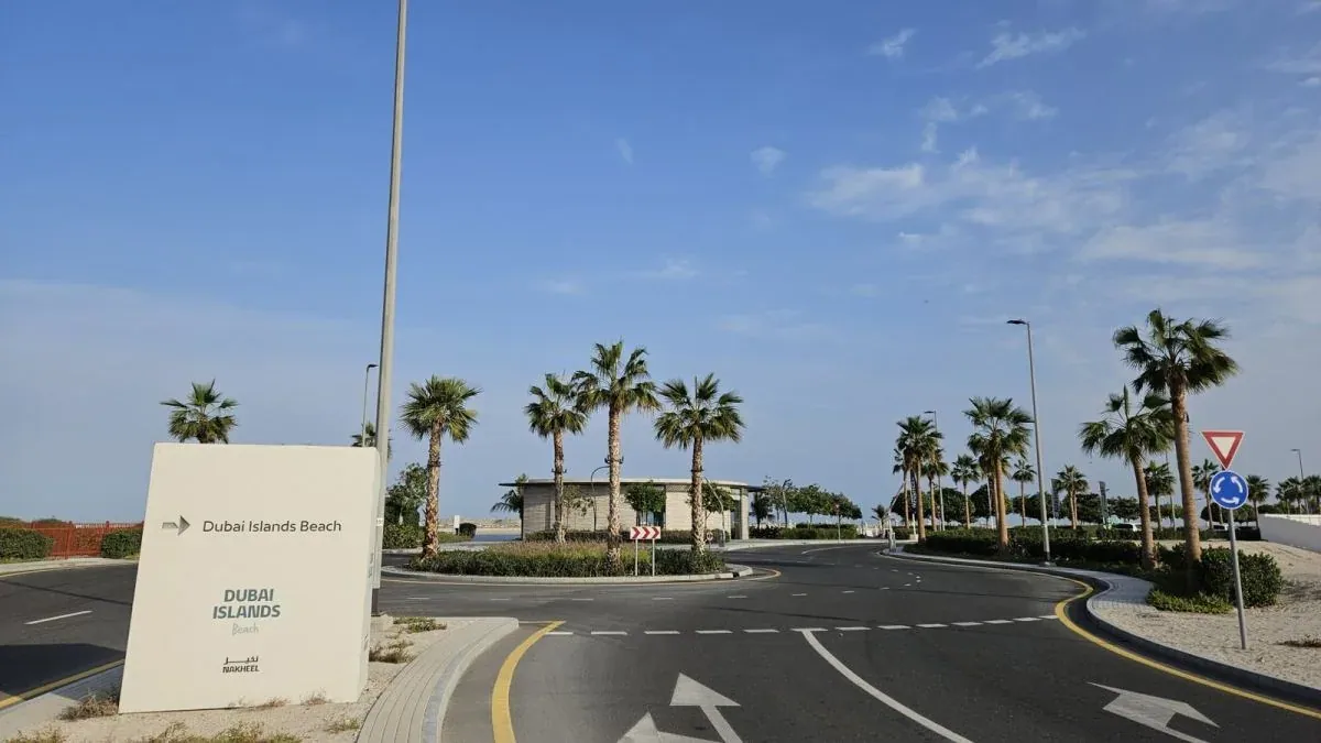 Dubai Islands Beach entrance roundabout with a Nakheel direction sign