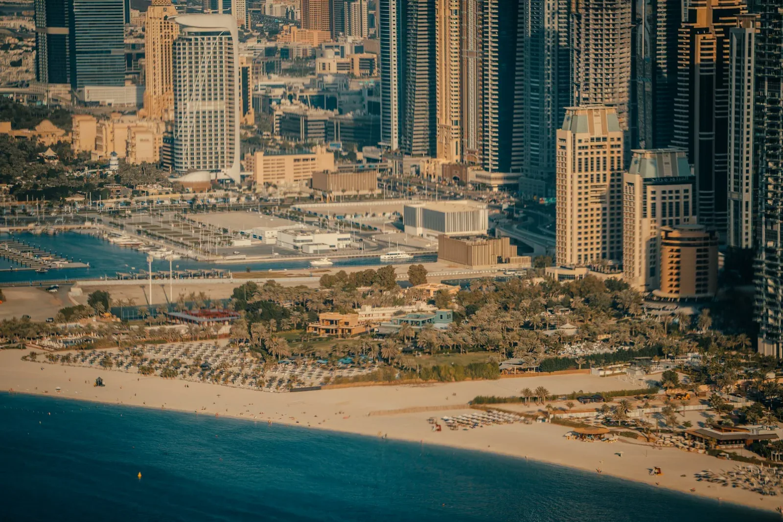 Elevated view of the Dubai Marina coastline, beachfront resorts and towers