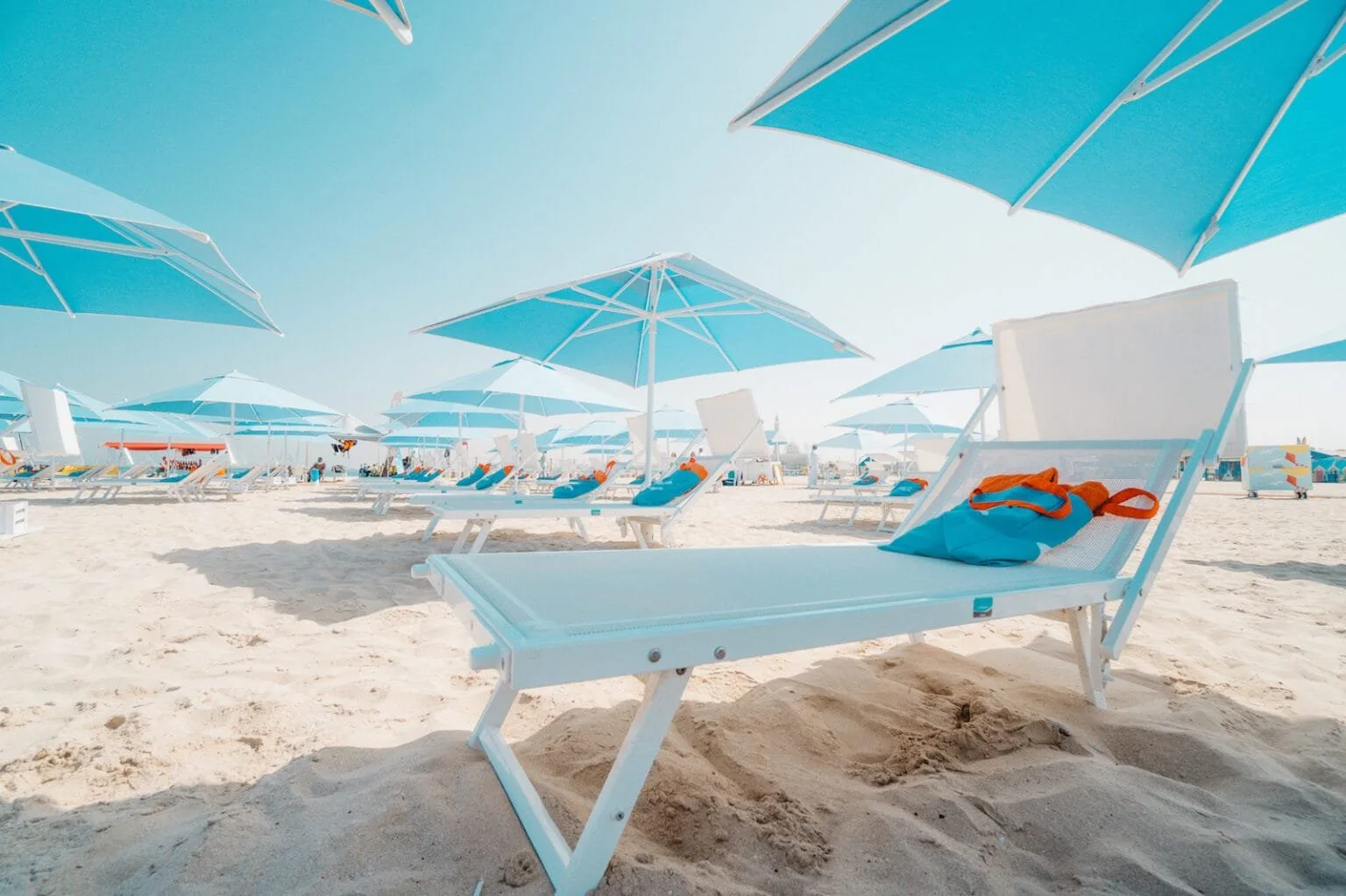 Sole Mio loungers and blue umbrellas on Kite Beach